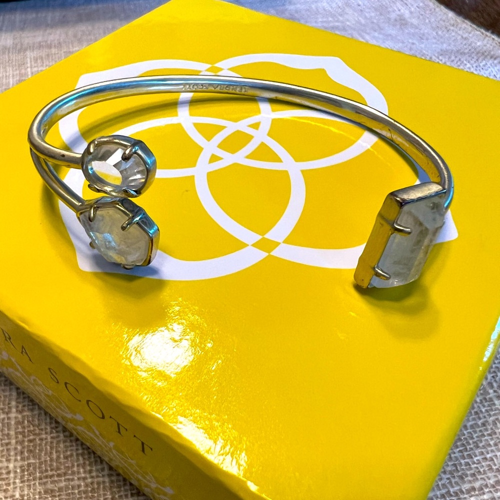 Kendra Scott bracelet. Clear stones on gold band.